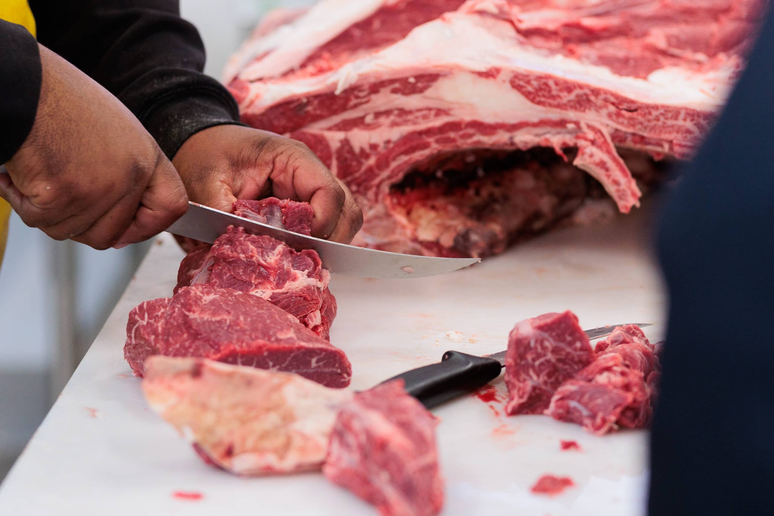A close up of beef being sliced